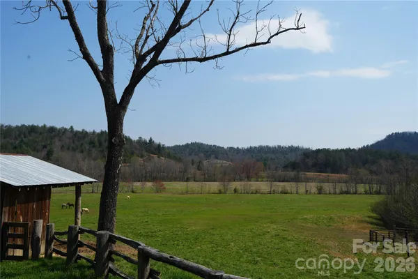 a view of a big yard next to a lake