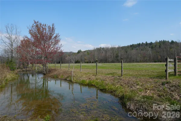 a view of a lake with a yard
