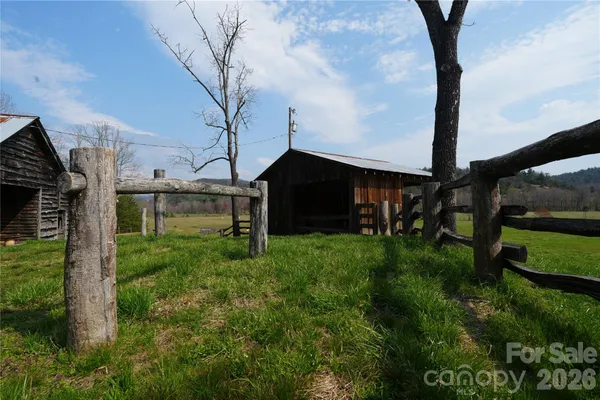 a view of house with backyard