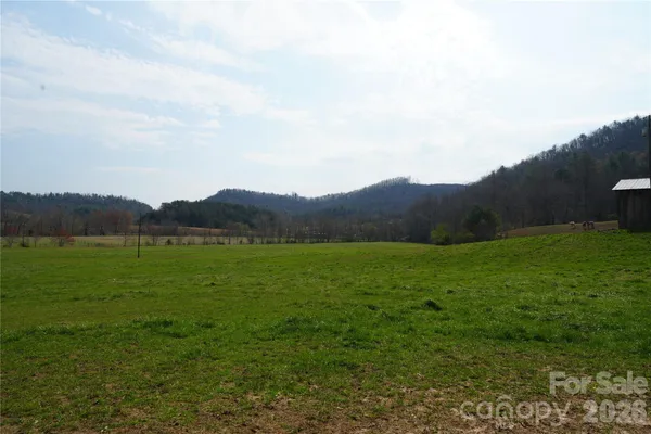 a view of an ocean and mountains