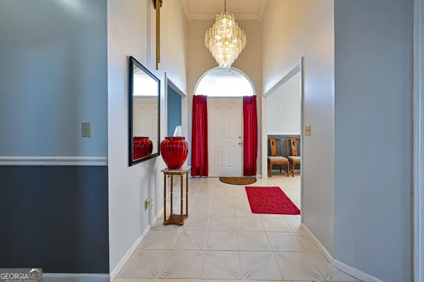 a view of a livingroom with furniture and chandelier