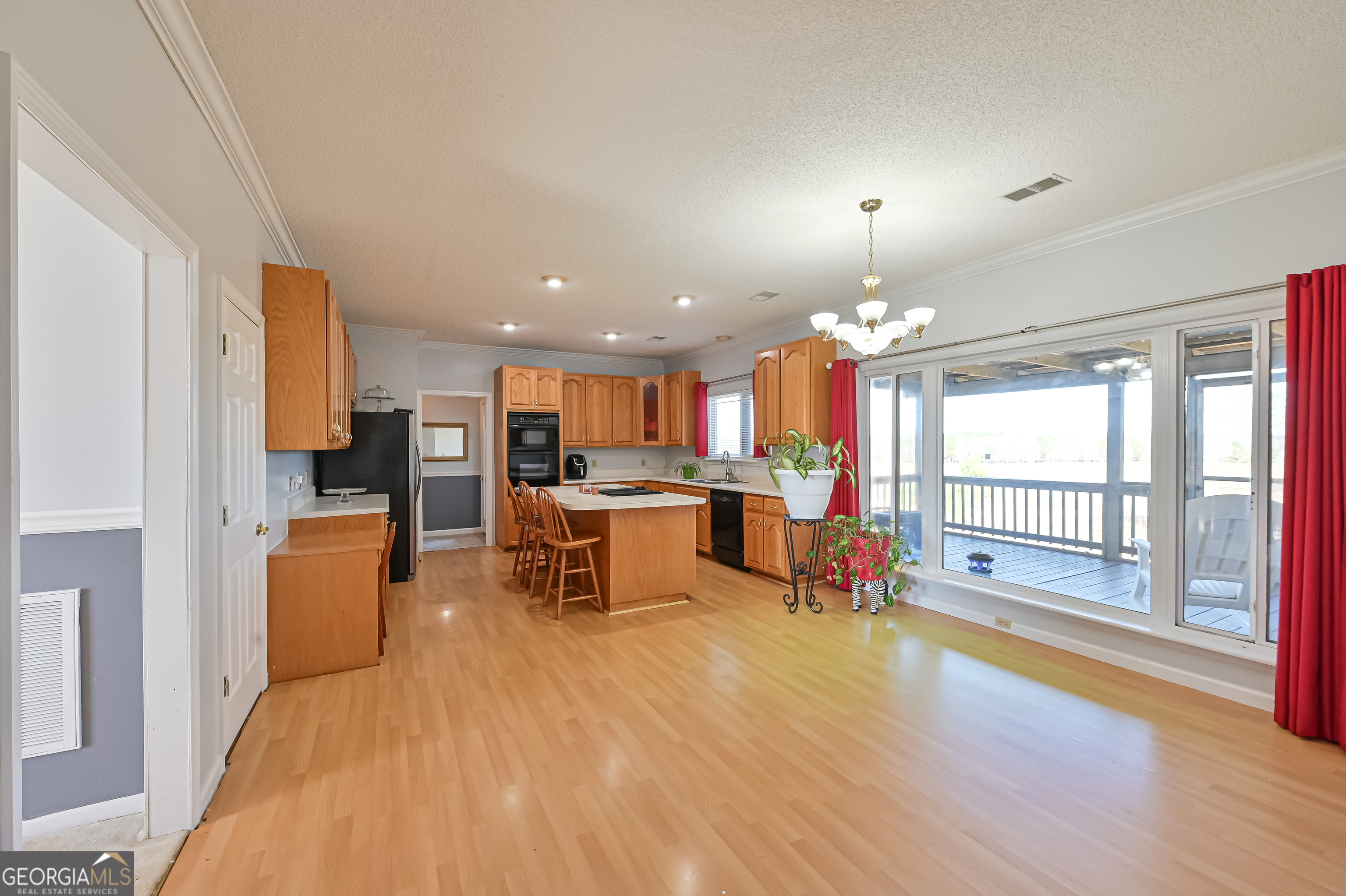 5152 Sandy Bottom Road Blakely, GA 39823 - Photo 22 of 40 a living room with furniture dining table and a fireplace