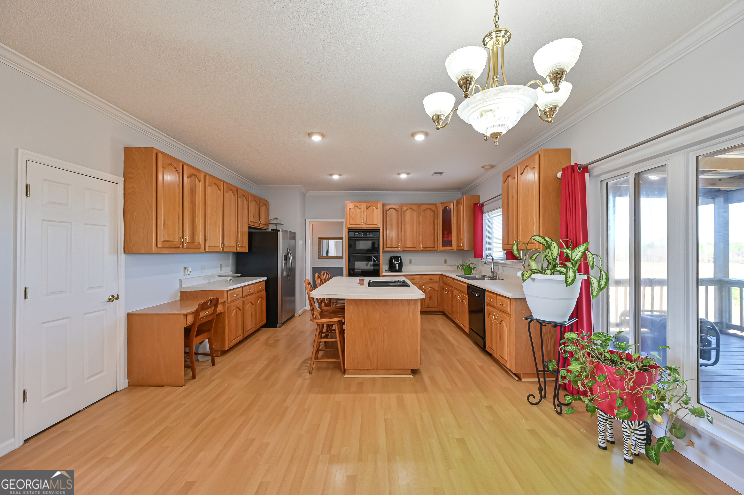 5152 Sandy Bottom Road Blakely, GA 39823 - Photo 23 of 40 a large kitchen with stainless steel appliances granite countertop a stove and cabinets