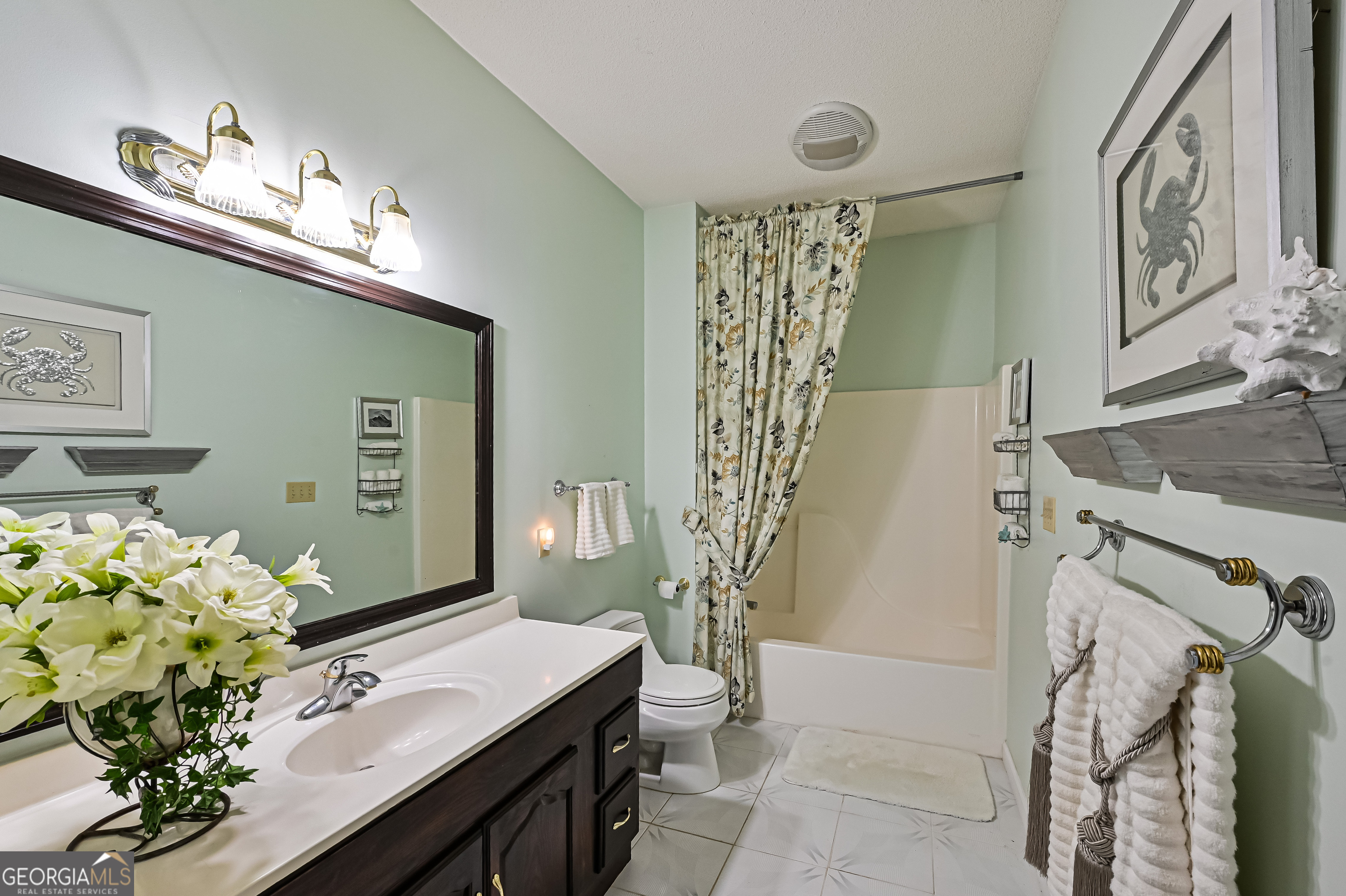 5152 Sandy Bottom Road Blakely, GA 39823 - Photo 30 of 40 a bath room with a sink furniture and a chandelier