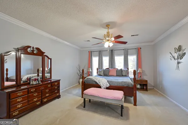 a bathroom with a tub shower and sink