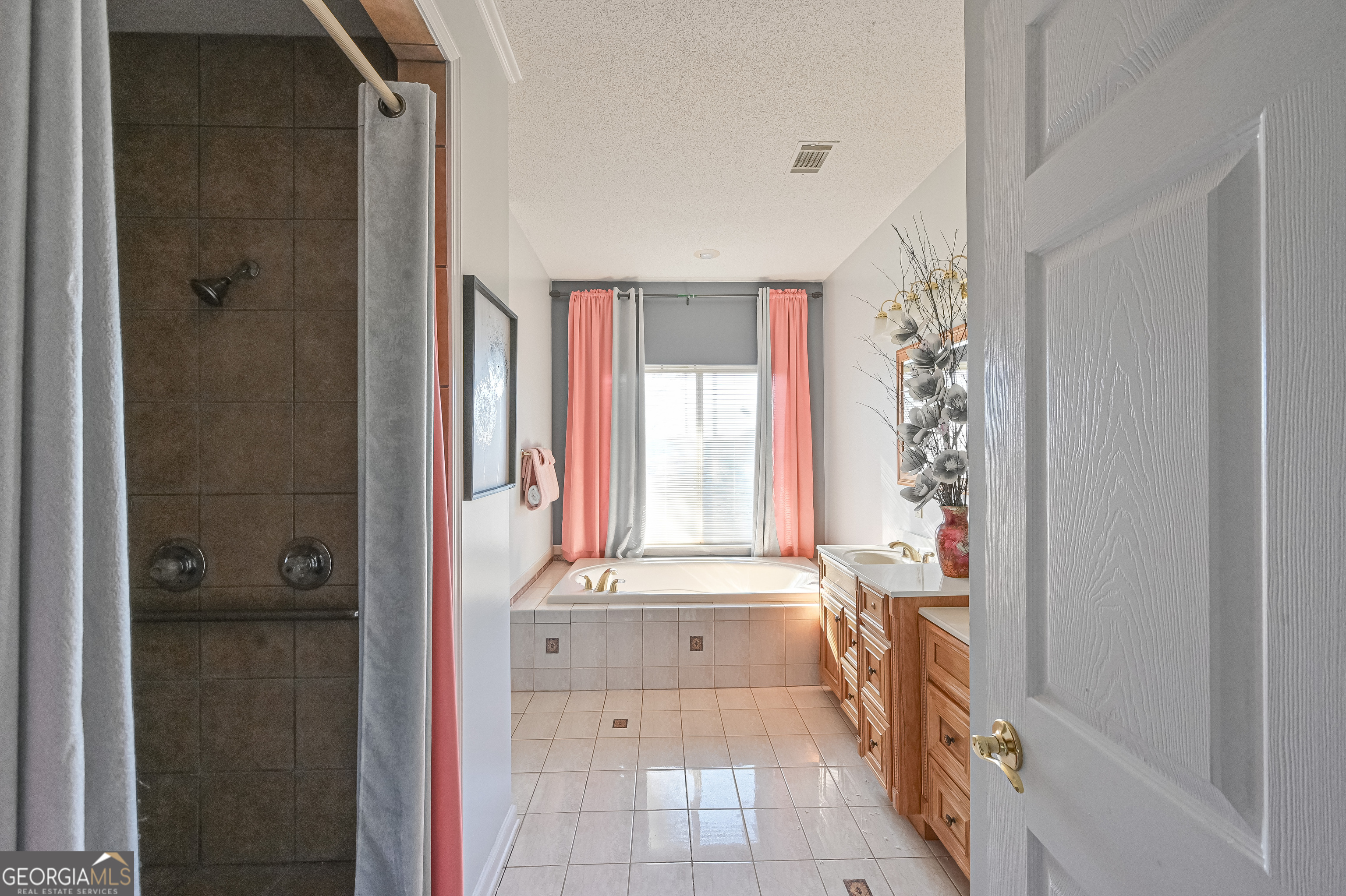 5152 Sandy Bottom Road Blakely, GA 39823 - Photo 35 of 40 a bathroom with a tub shower and sink