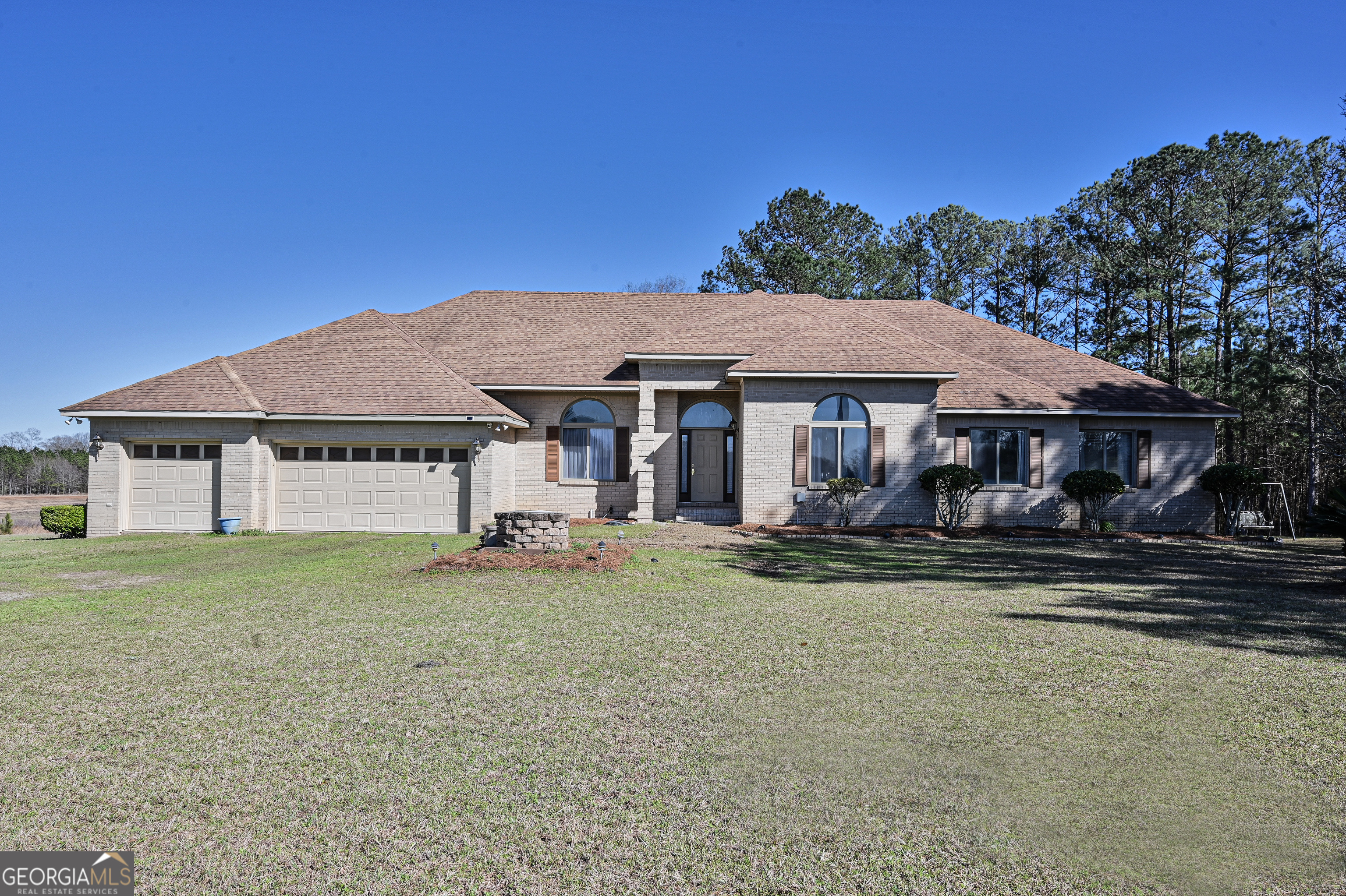 5152 Sandy Bottom Road Blakely, GA 39823 - Photo 4 of 40 a front view of a house with garden