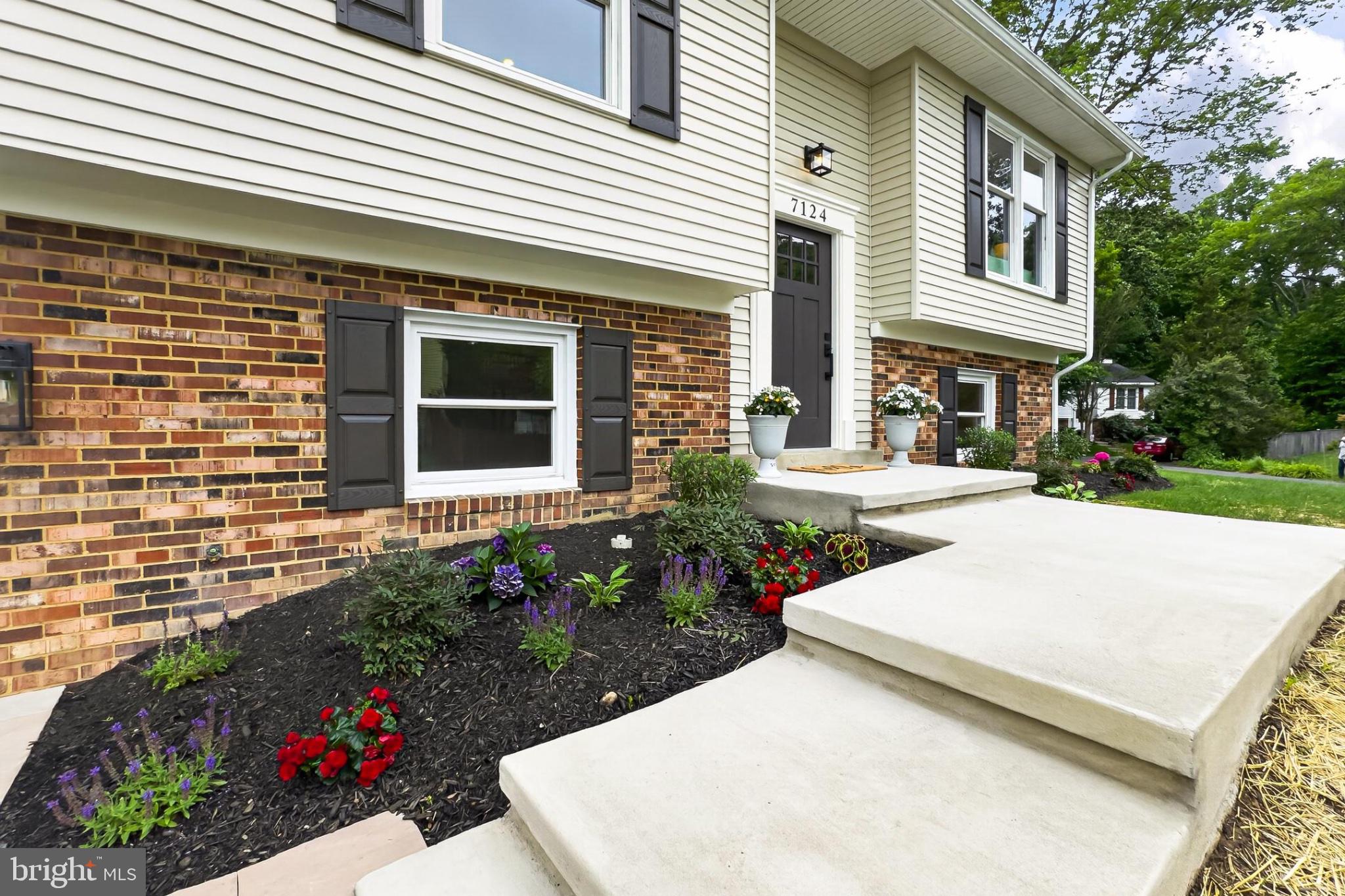 7124 Whetstone Road Alexandria, VA 22306 - Photo 4 of 37 Charming entry with vibrant landscaping.
