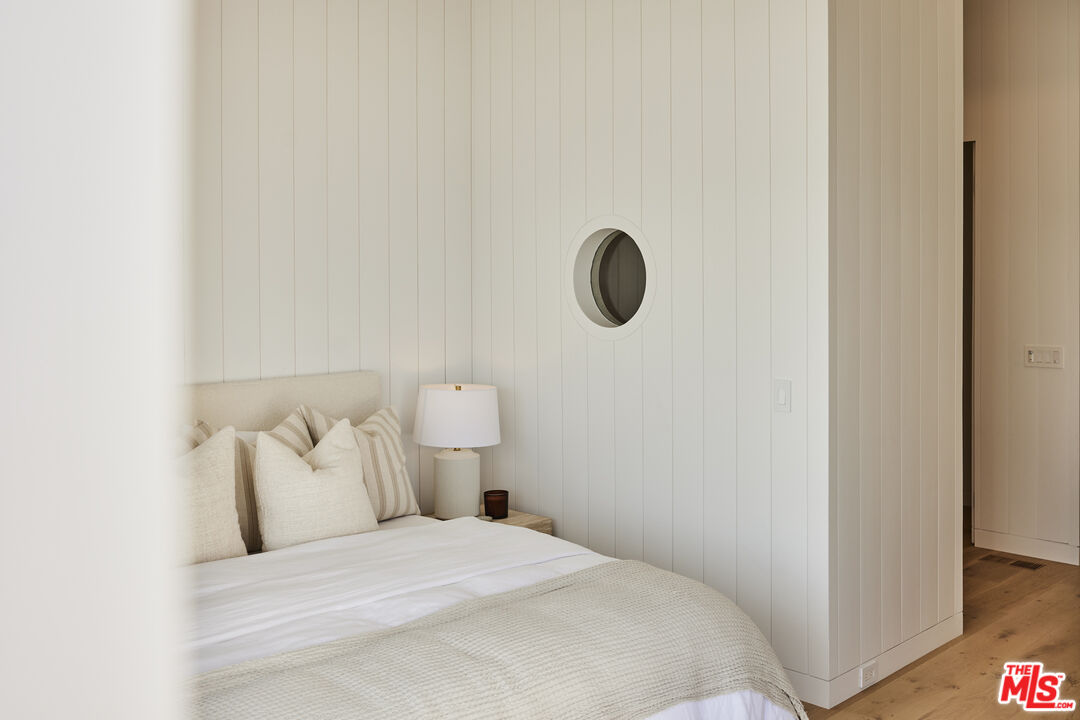 27356 Escondido Beach Road Malibu, CA 90265 - Photo 12 of 17 a bedroom with a bed and a cabinets