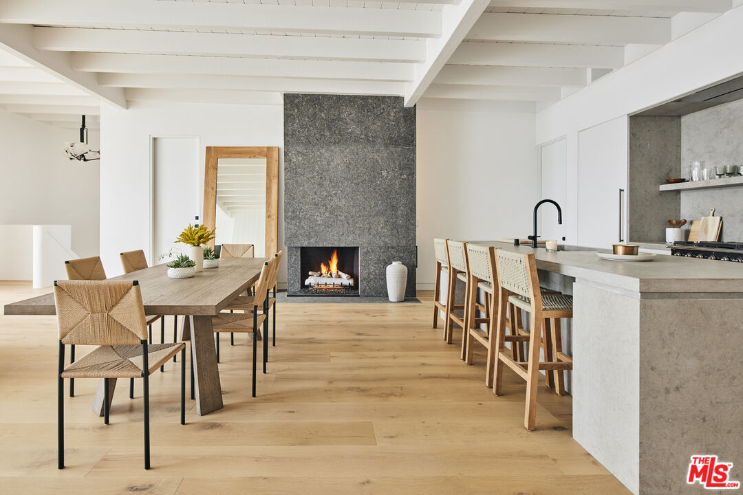27356 Escondido Beach Road Malibu, CA 90265 - Photo 3 of 17 a dining room with furniture and wooden floor