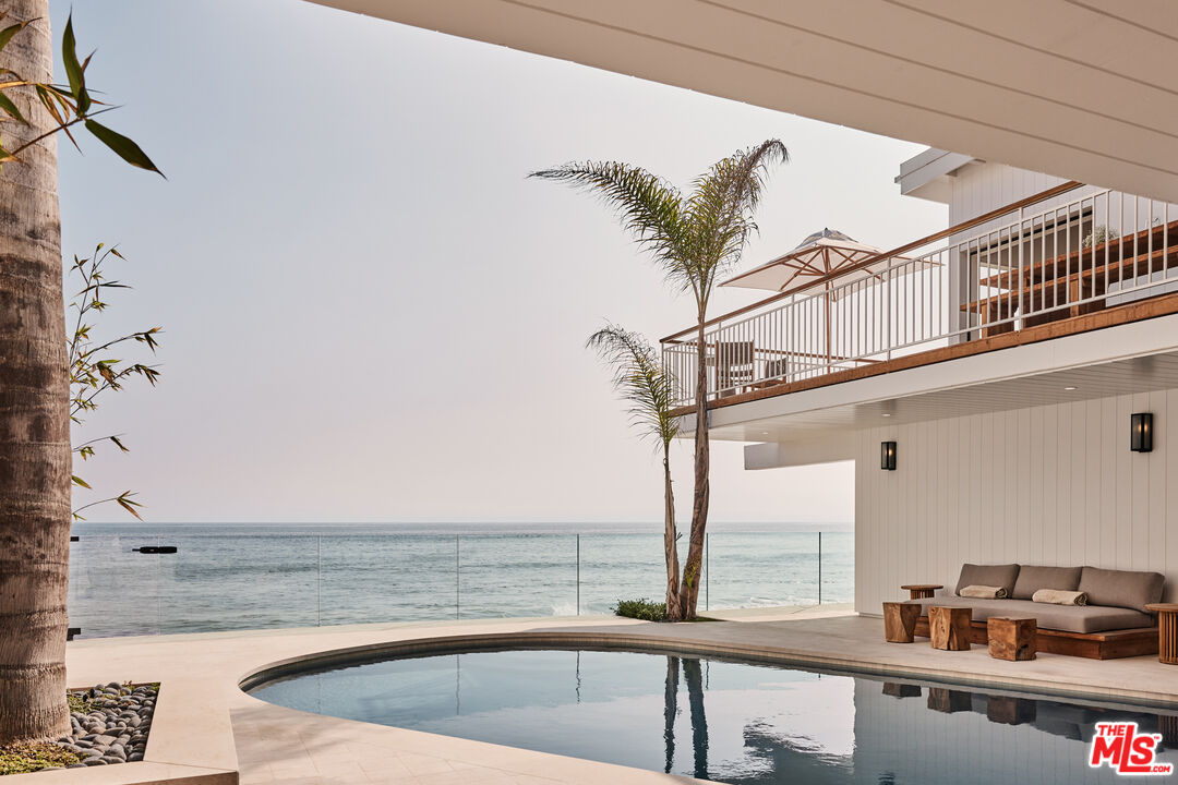 27356 Escondido Beach Road Malibu, CA 90265 - Photo 6 of 17 a view of a swimming pool with a chair