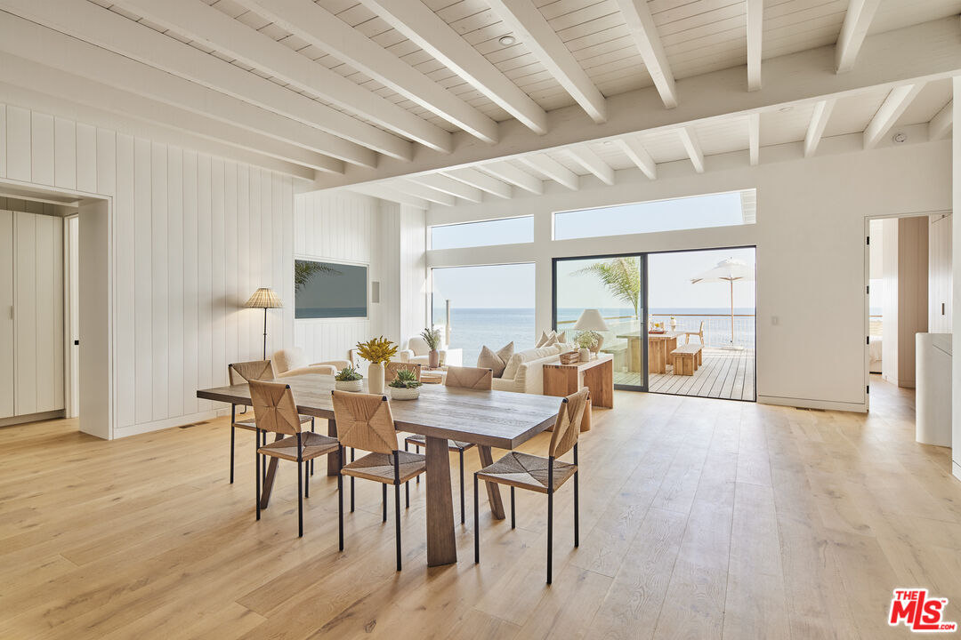 27356 Escondido Beach Road Malibu, CA 90265 - Photo 7 of 17 a view of a dining room with furniture and wooden floor