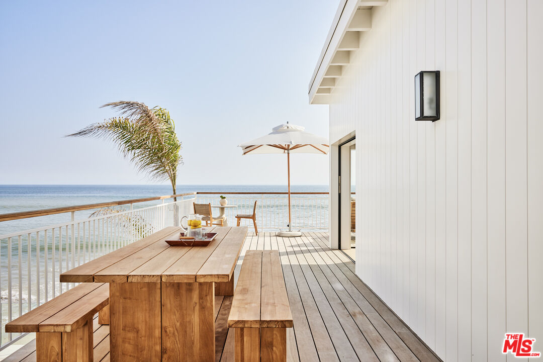27356 Escondido Beach Road Malibu, CA 90265 - Photo 9 of 17 a dining room with table and chairs