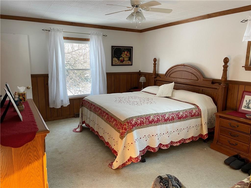 506 Lake Wilhelm Road Sandy Lake, PA 16145 - Photo 28 of 42 a bedroom with bed and a window