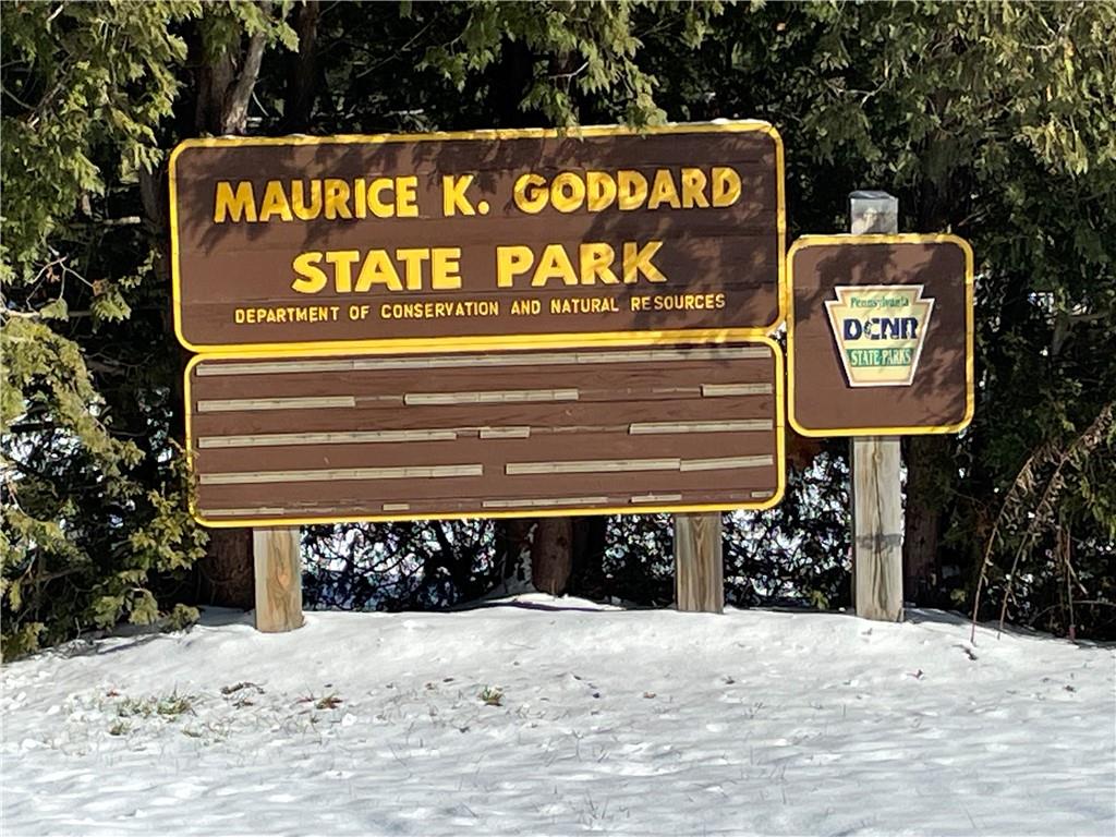 506 Lake Wilhelm Road Sandy Lake, PA 16145 - Photo 3 of 42 a sign on the side of a building