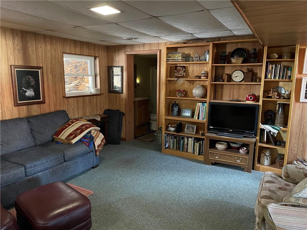 506 Lake Wilhelm Road Sandy Lake, PA 16145 - Photo 38 of 42 a living room with furniture a flat screen tv and a window