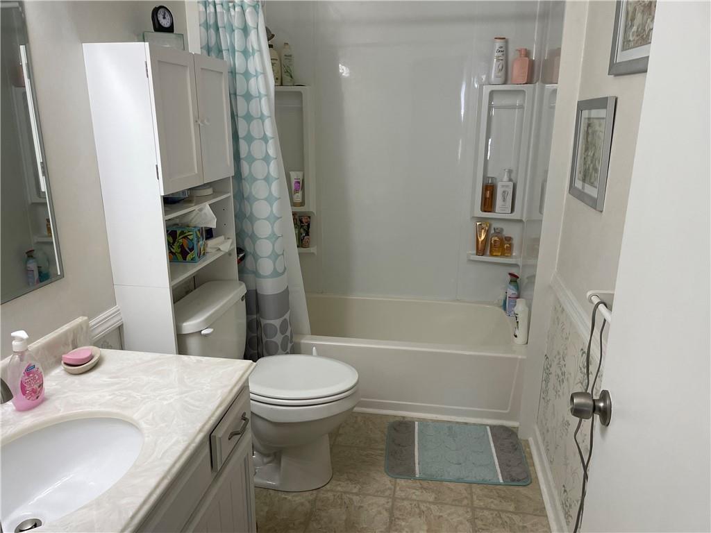 506 Lake Wilhelm Road Sandy Lake, PA 16145 - Photo 42 of 42 a bathroom with a sink toilet and shower