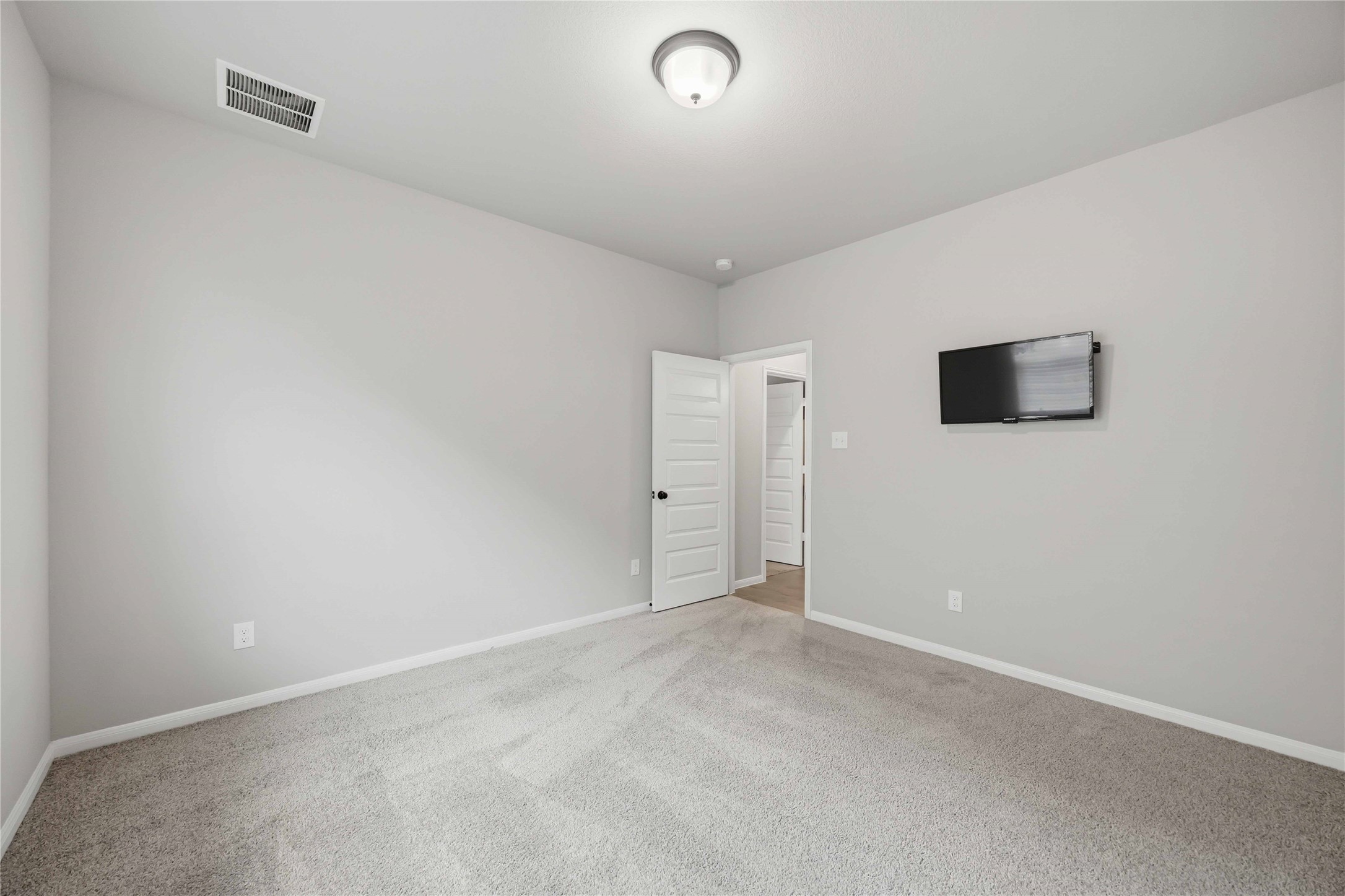 2808 Bisbee Road League City, TX 77573 - Photo 15 of 42 Bedroom 5- Grey Carpet & Black Finishes