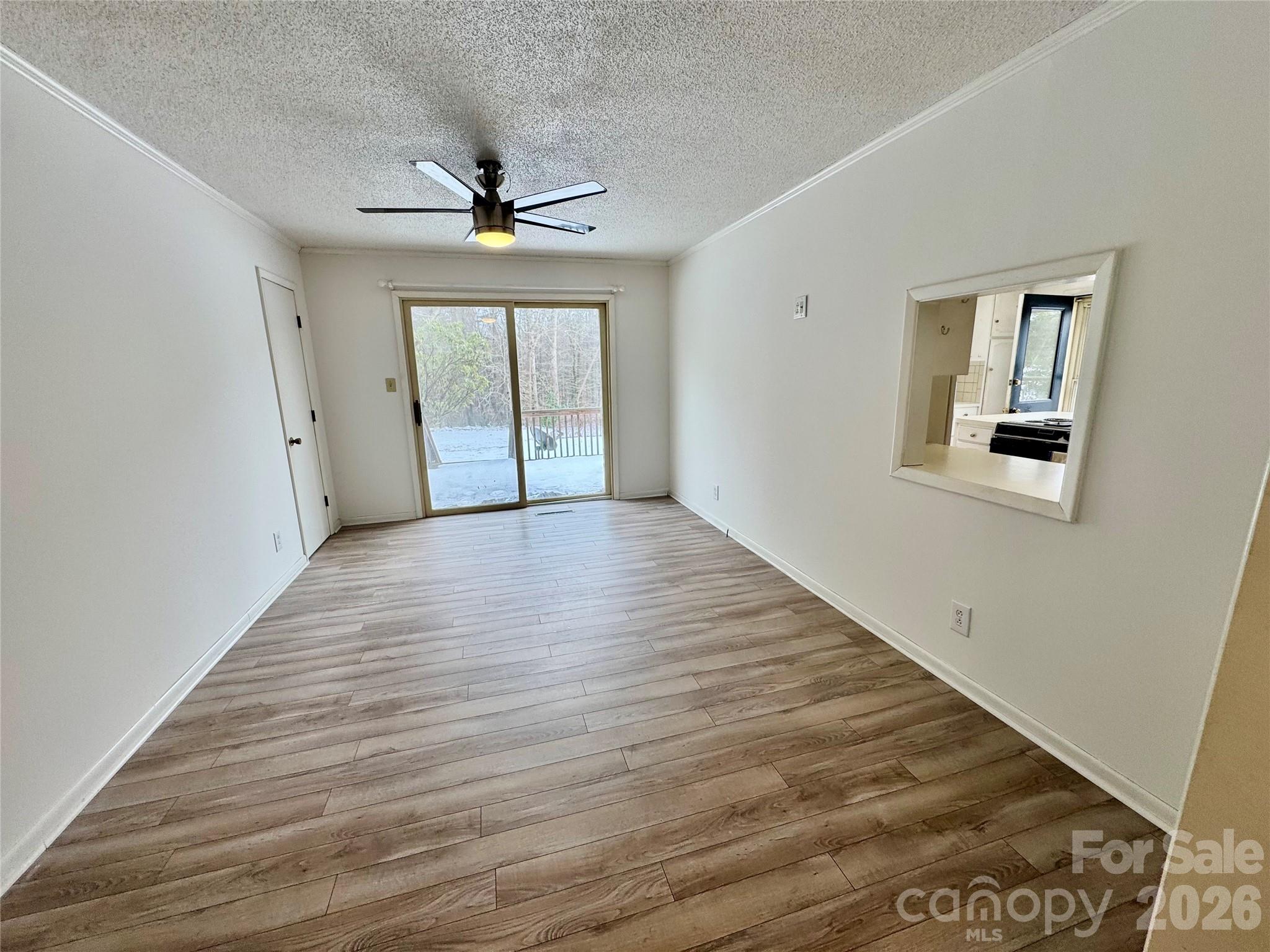 3134 Asbury Church Road Lincolnton, NC 28092 - Photo 11 of 24 wooden floor in an empty room with a window