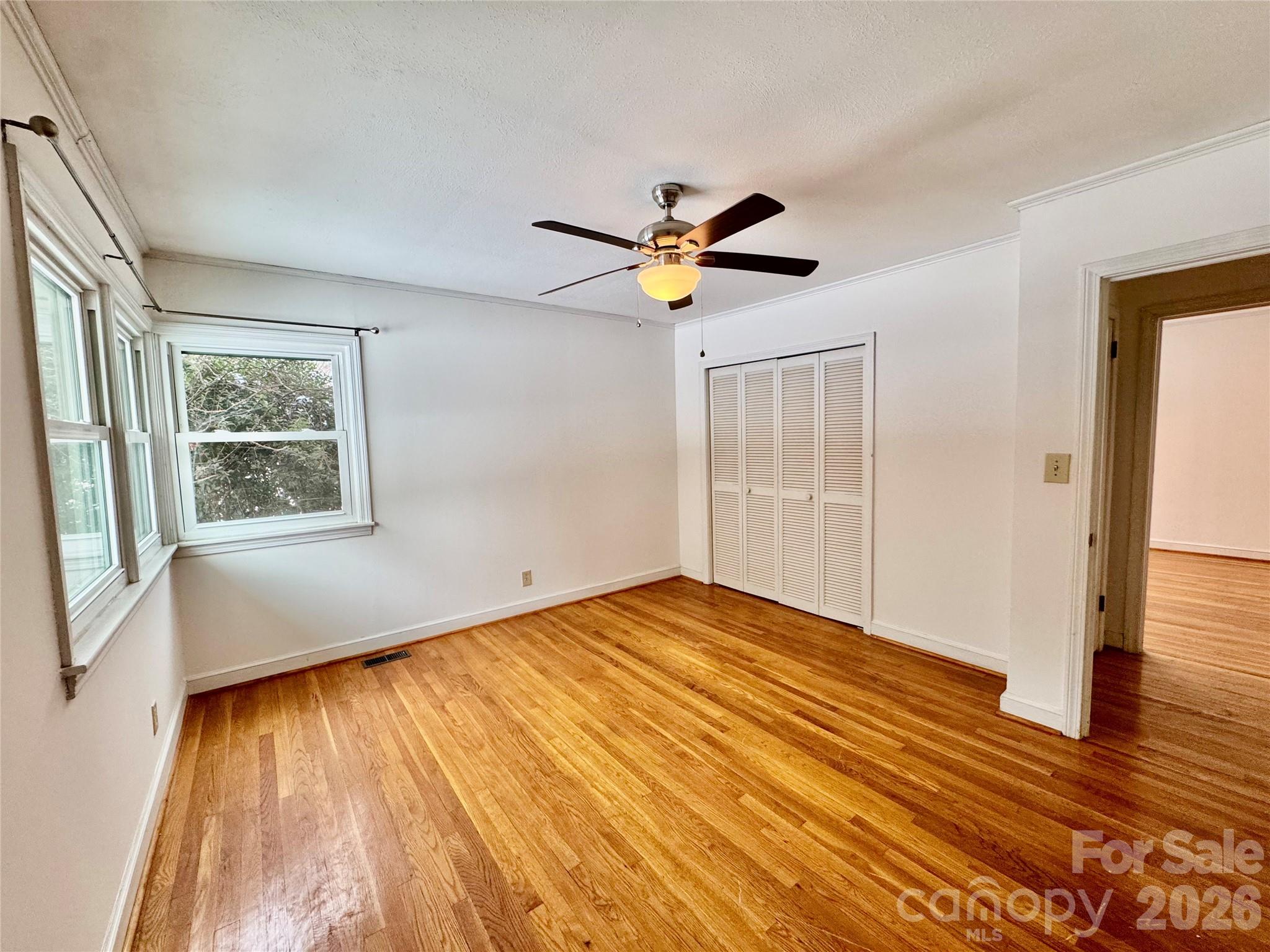 3134 Asbury Church Road Lincolnton, NC 28092 - Photo 12 of 24 a view of empty room with wooden floor and fan