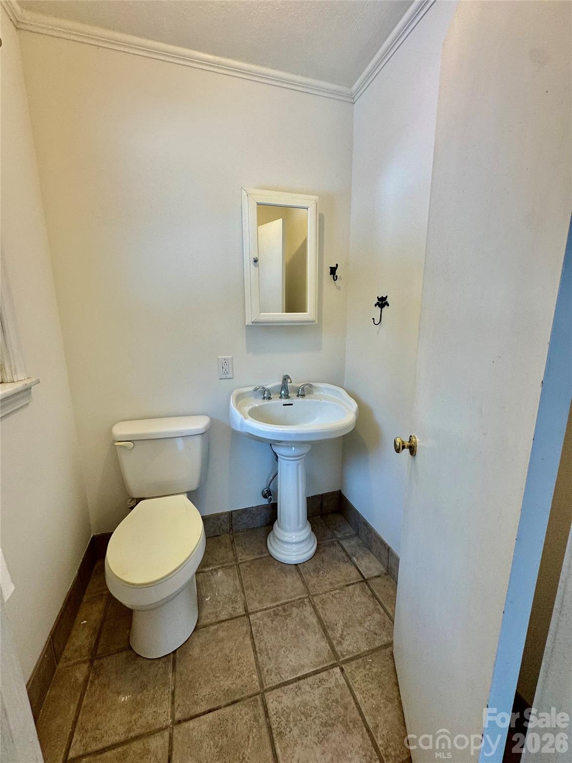 3134 Asbury Church Road Lincolnton, NC 28092 - Photo 14 of 24 a bathroom with a toilet a sink and a mirror