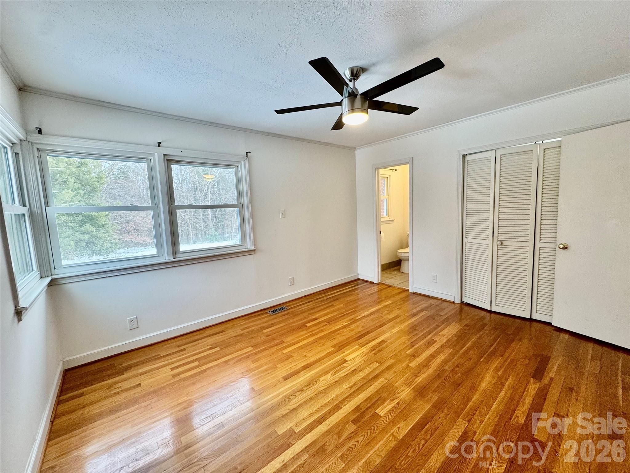 3134 Asbury Church Road Lincolnton, NC 28092 - Photo 16 of 24 a view of empty room with wooden floor and fan