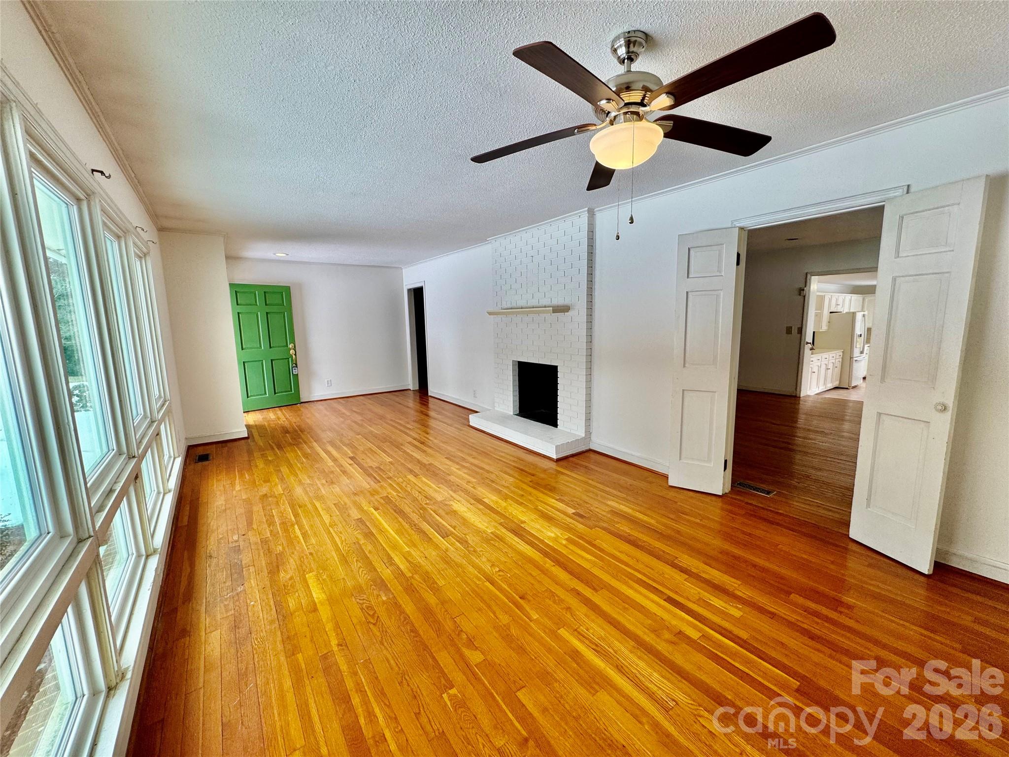 3134 Asbury Church Road Lincolnton, NC 28092 - Photo 2 of 24 a bedroom with a bed and a chandelier