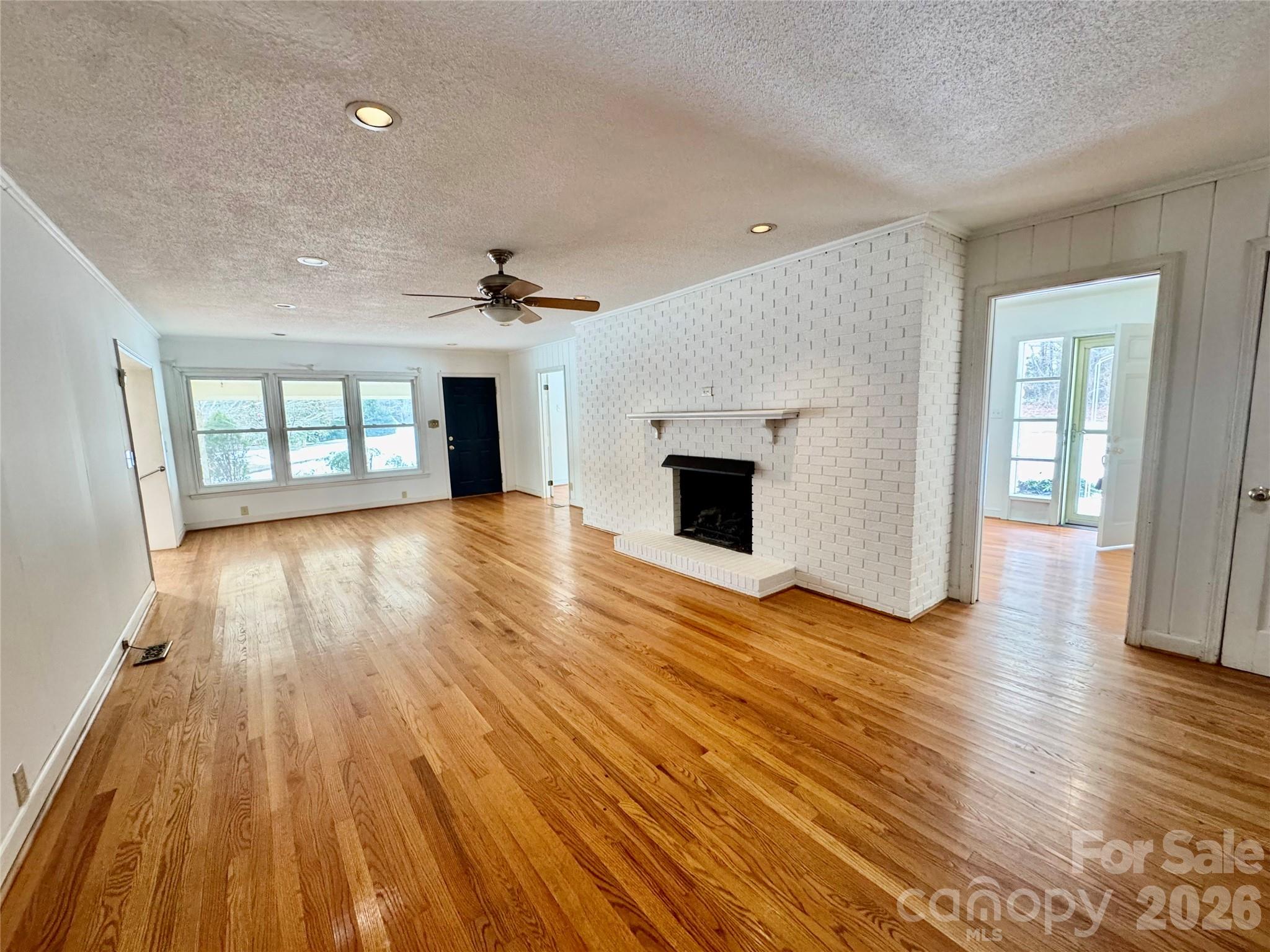 3134 Asbury Church Road Lincolnton, NC 28092 - Photo 4 of 24 wooden floor fireplace and natural light in room