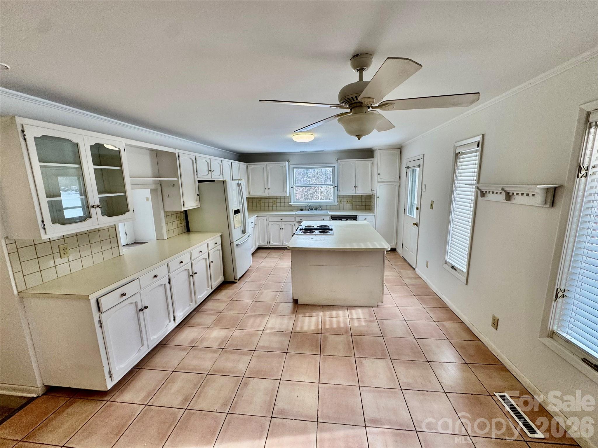 3134 Asbury Church Road Lincolnton, NC 28092 - Photo 6 of 24 a large white kitchen with cabinets