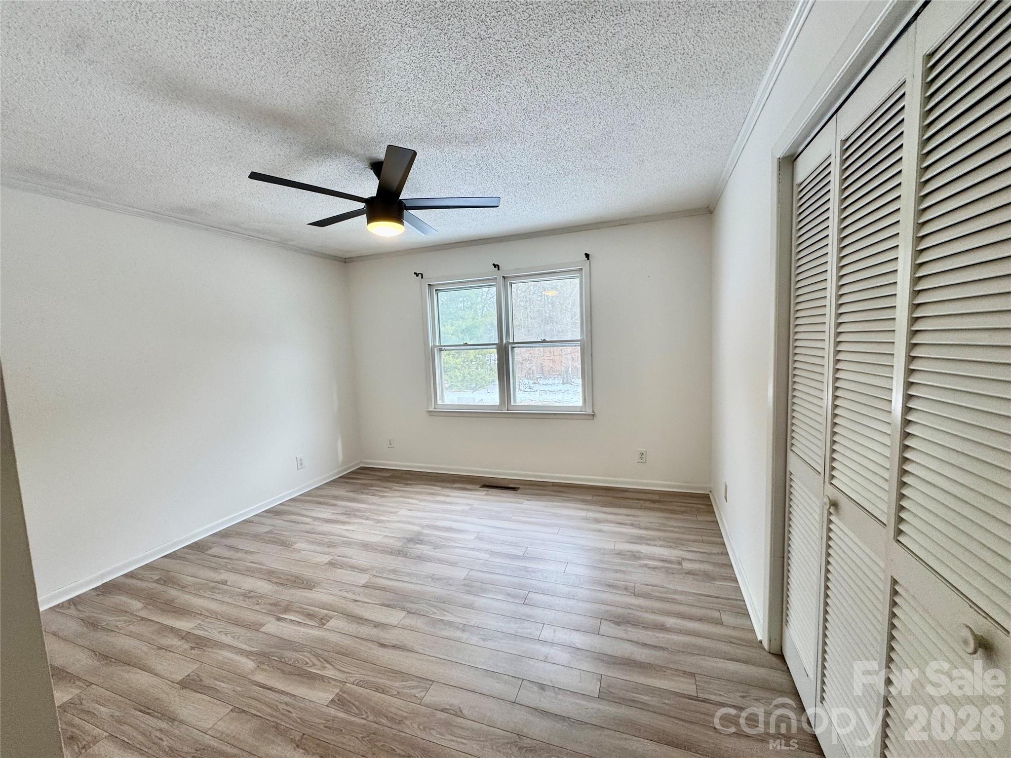 3134 Asbury Church Road Lincolnton, NC 28092 - Photo 9 of 24 a view of a livingroom with a ceiling fan and window