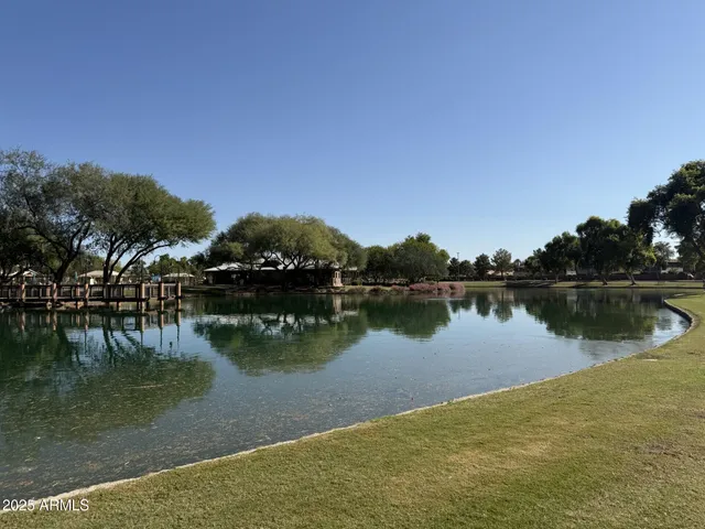 a view of a lake with a yard