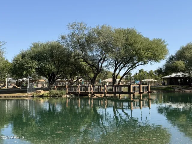 a water view with boat and trees in the background