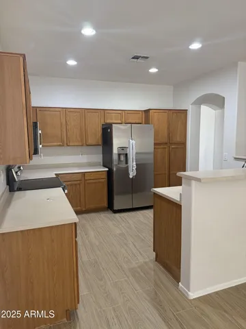 a kitchen with counter top space and stainless steel appliances