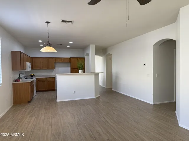 a view of a kitchen with microwave and stove