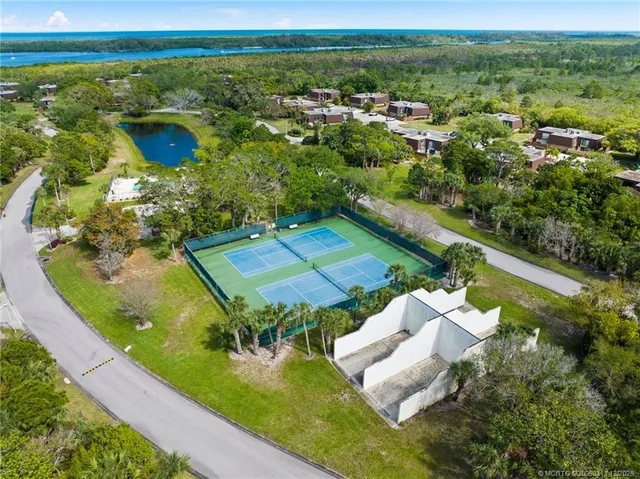 an aerial view of a house with a ocean view