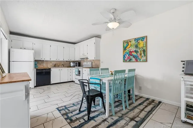 a view of kitchen with cabinets and outdoor space