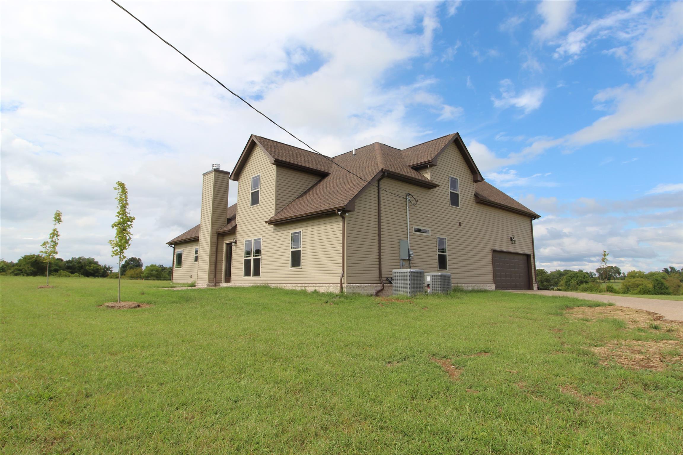 3840 Linwood Road Watertown, TN 37184 - Photo 3 of 23 a big house with a big yard and large trees