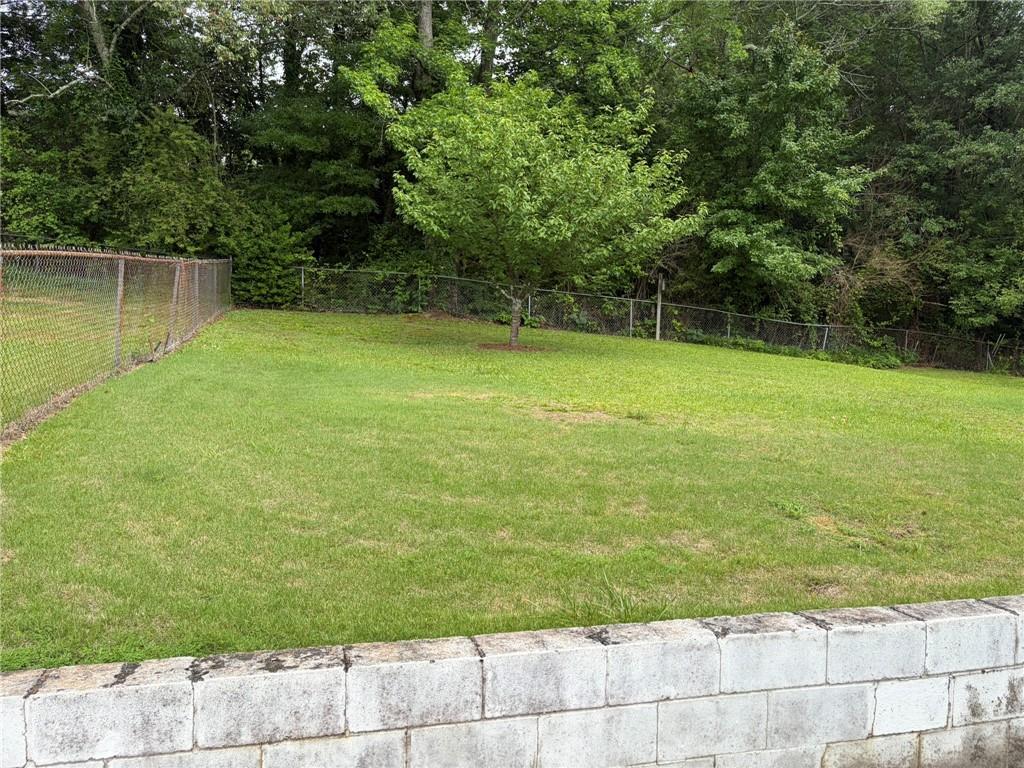 52 Lyons Drive Northwest Rome, GA 30165 - Photo 24 of 34 a view of a yard with a small cabin