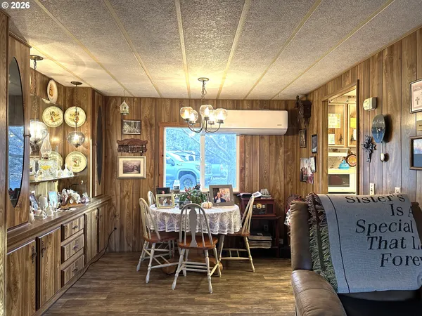 a view of a dining room with furniture and window