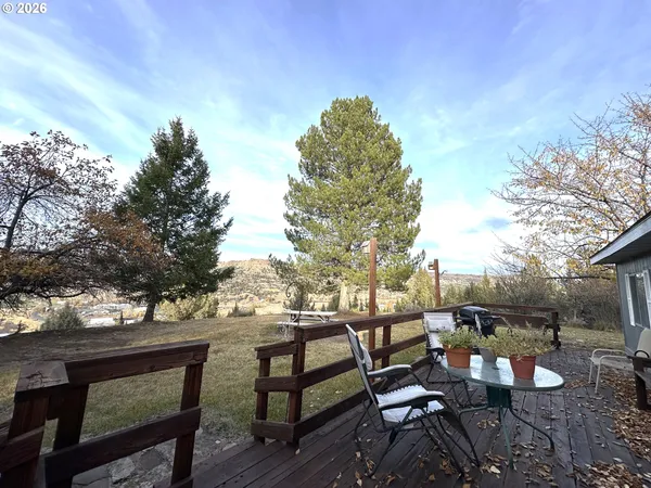 a view of a bench in a backyard