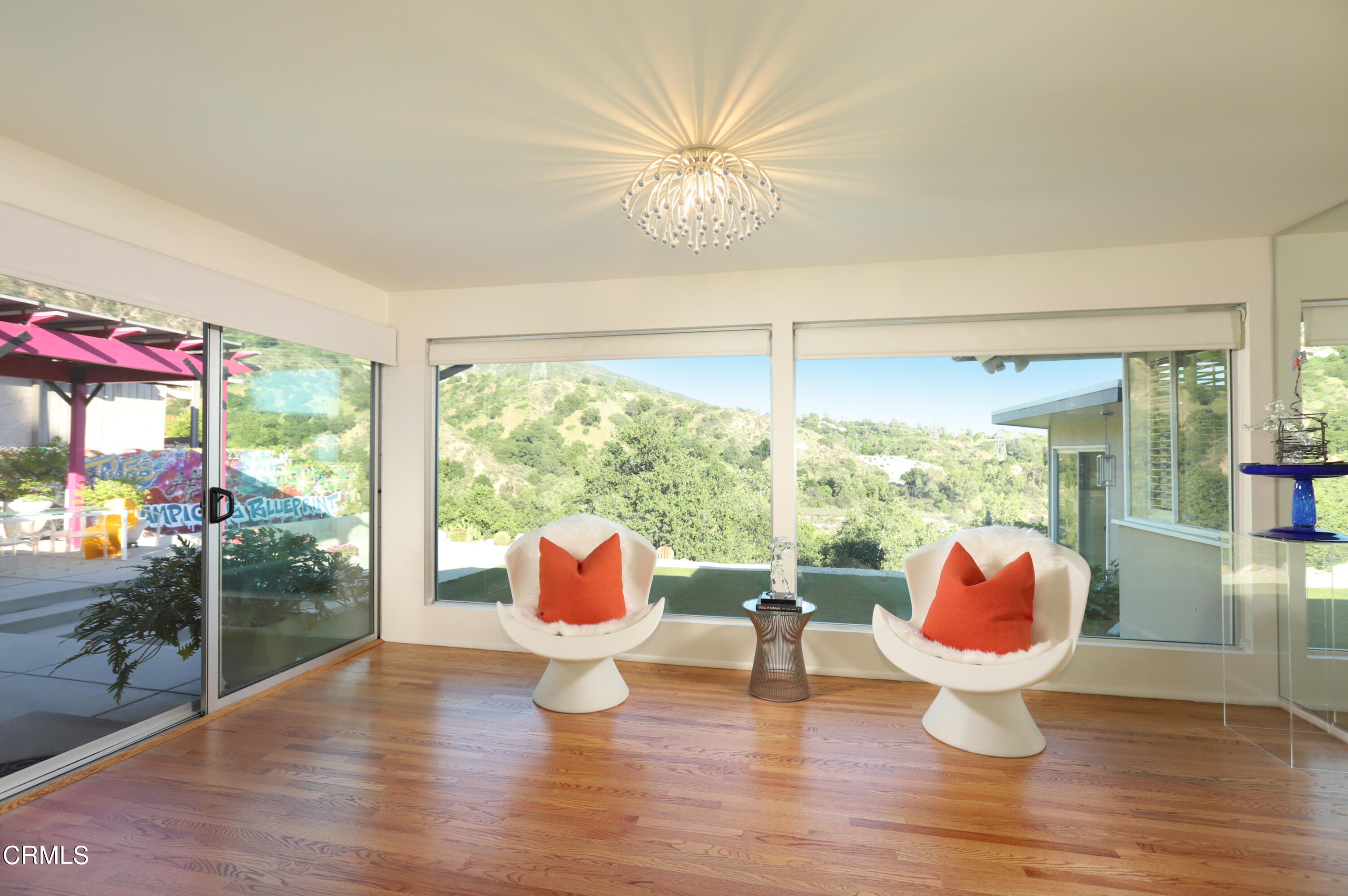 1950 Canyon Close Road Pasadena, CA 91107 - Photo 8 of 48 a very nice looking room with a large window with wooden floor and a yard