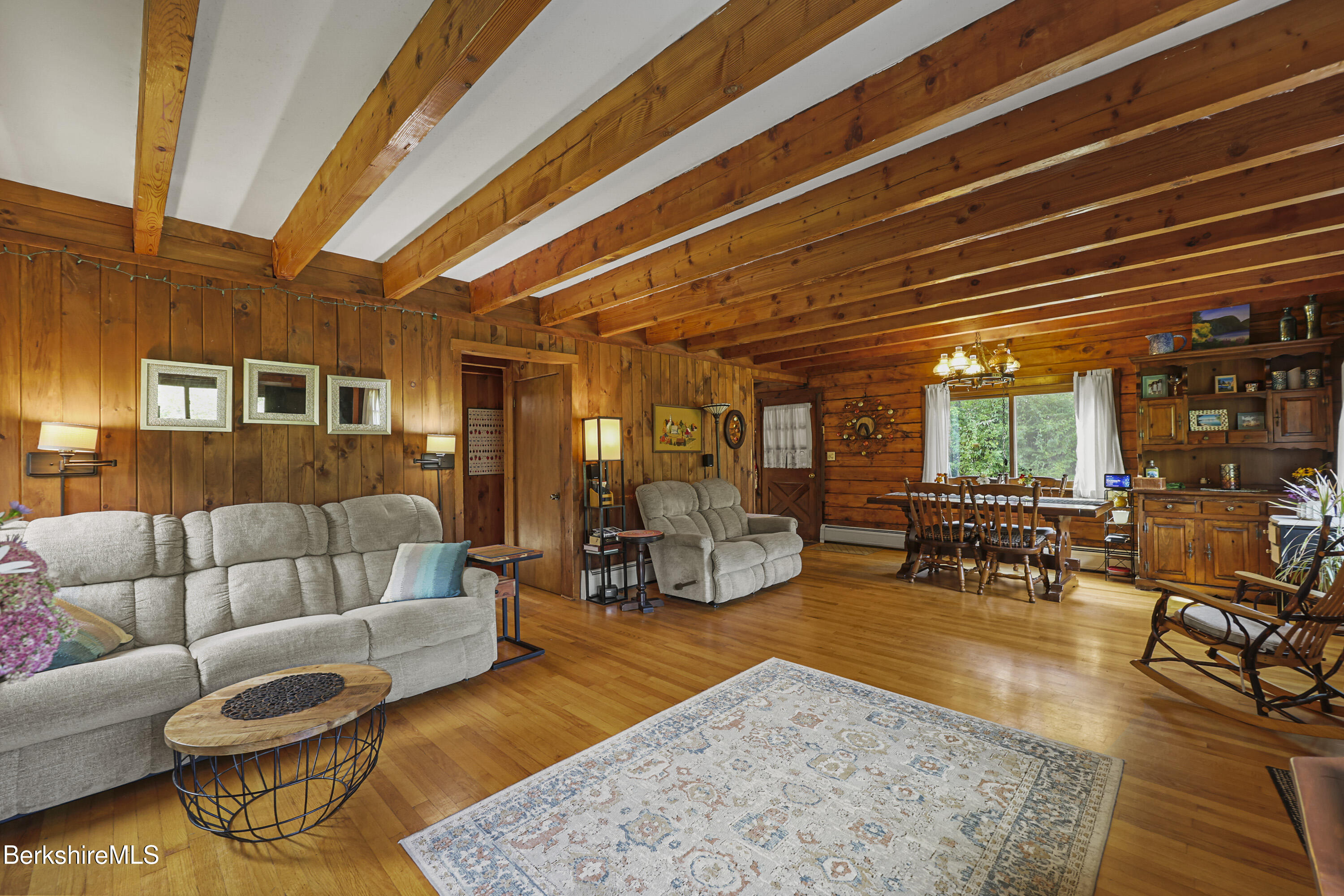 78 East Main Road Peru, MA 01235 - Photo 15 of 56 a living room with furniture and a dining table with wooden floor