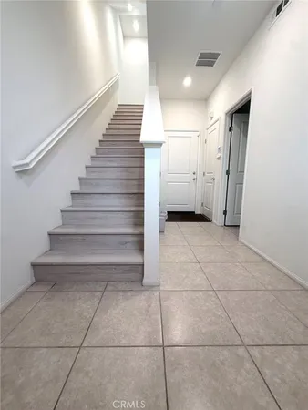 a view of entryway and hall with a window