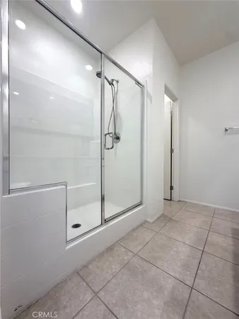 a view of bathroom with a glass door shower