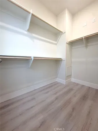 a view of a room with shelf on the wall
