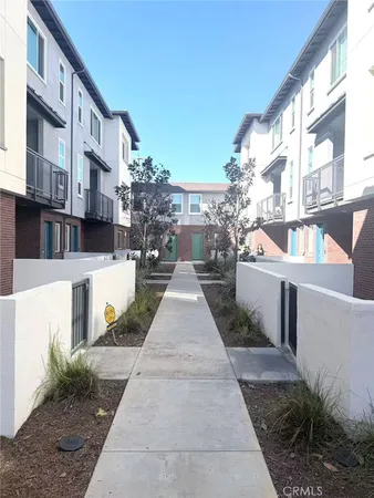 a view of buildings with yard