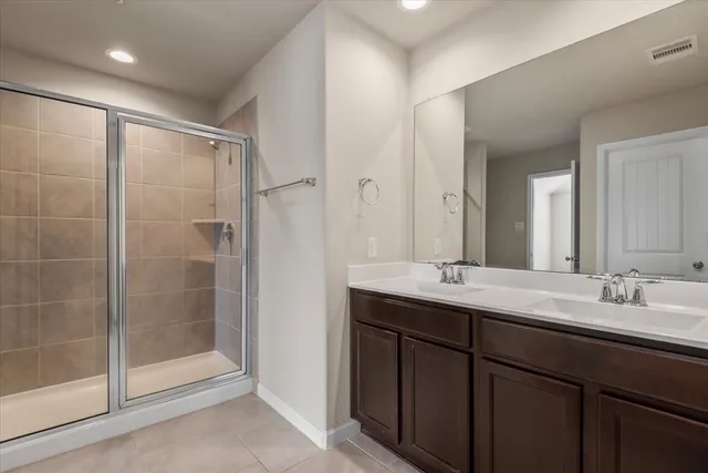 a bathroom with a granite countertop sink mirror and double