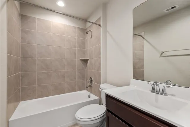 a bathroom with a sink a toilet and bathtub