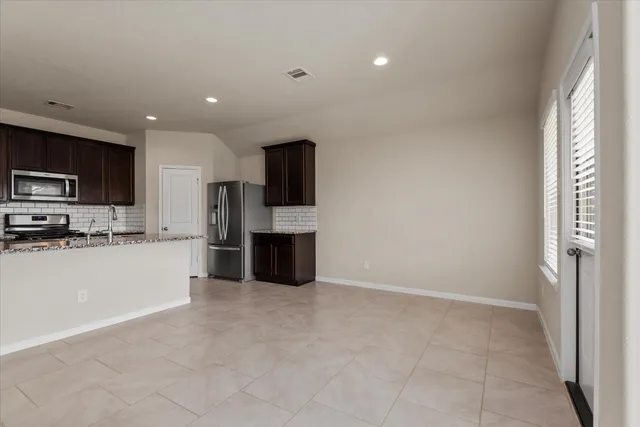 a large kitchen with cabinets
