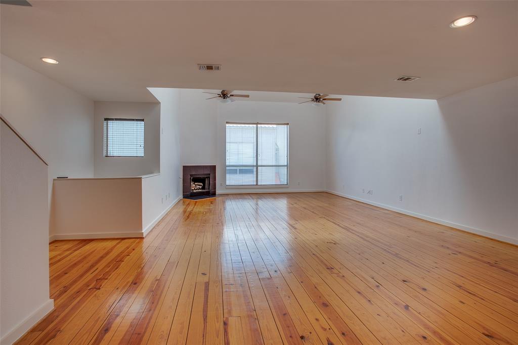 3840 San Jacinto Street Dallas, TX 75204 - Photo 14 of 34 wooden floor in an empty room with a window